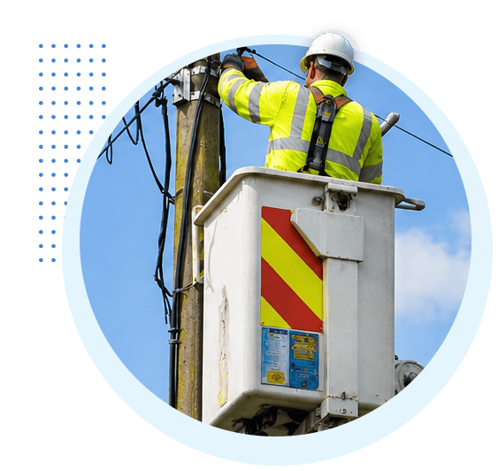 Engineer working on telephone lines during a power outage, illustrating the question: Will my landline work in a power cut after the digital switchover?